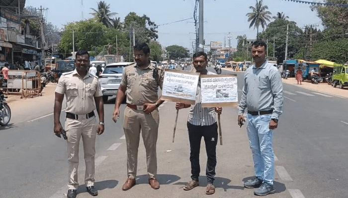 ಟ್ರಾಫಿಕ್‌ ರೂಲ್ಸ್‌ ಬ್ರೇಕ್‌ ಮಾಡಿದ್ದಕ್ಕೆ ಇಡೀ ದಿನ ರಸ್ತೆ ಮಧ್ಯೆ ಬೋರ್ಡ್ ಹಿಡಿದು ನಿಲ್ಲುವ ಶಿಕ್ಷೆ ನೀಡಿದ ಕೋರ್ಟ್!